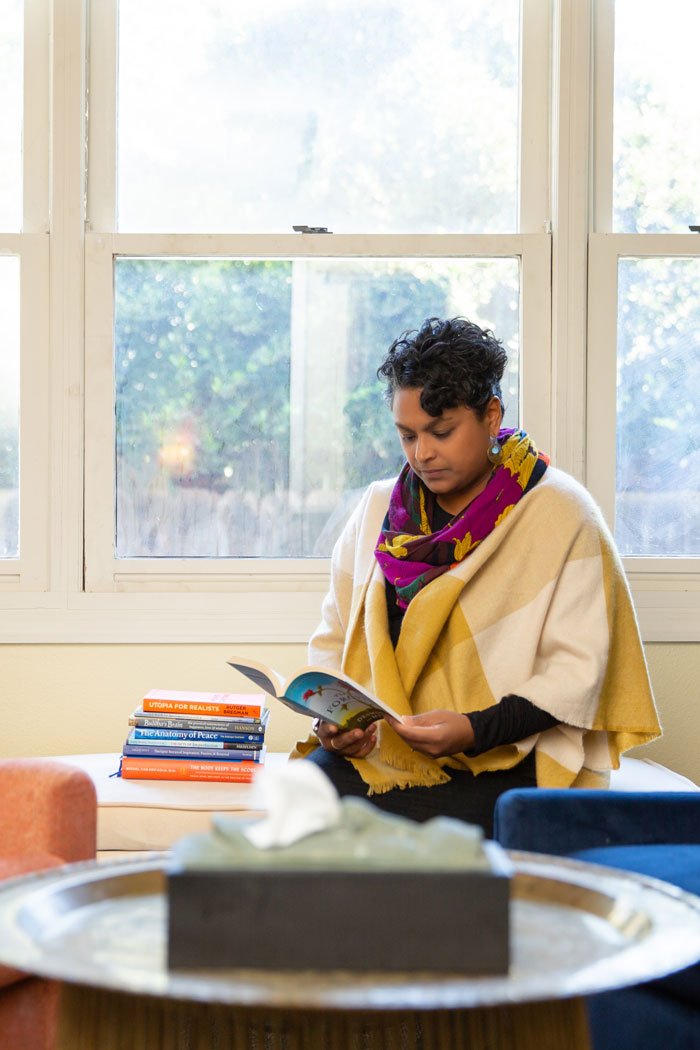 Juni in her office reading