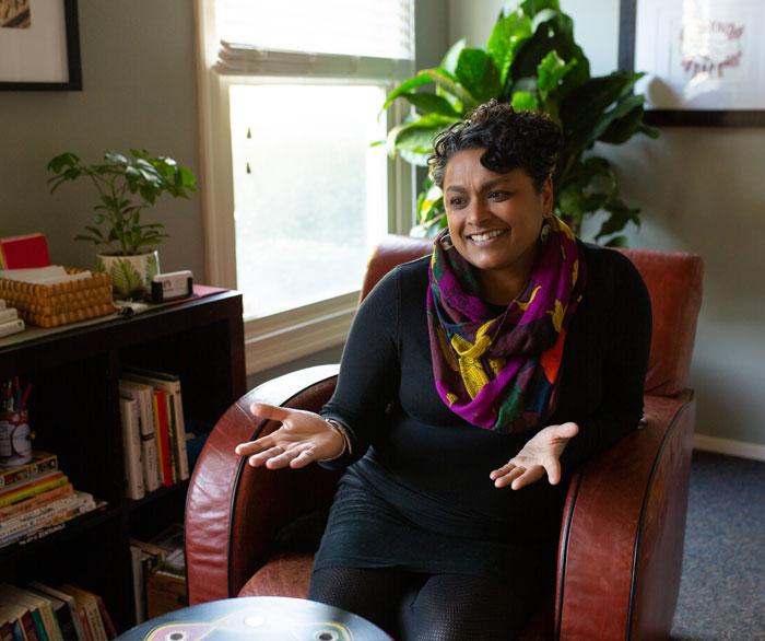 Juni talking in her office