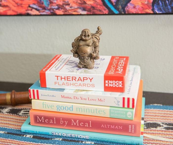 Buddah statue on top of therapy books